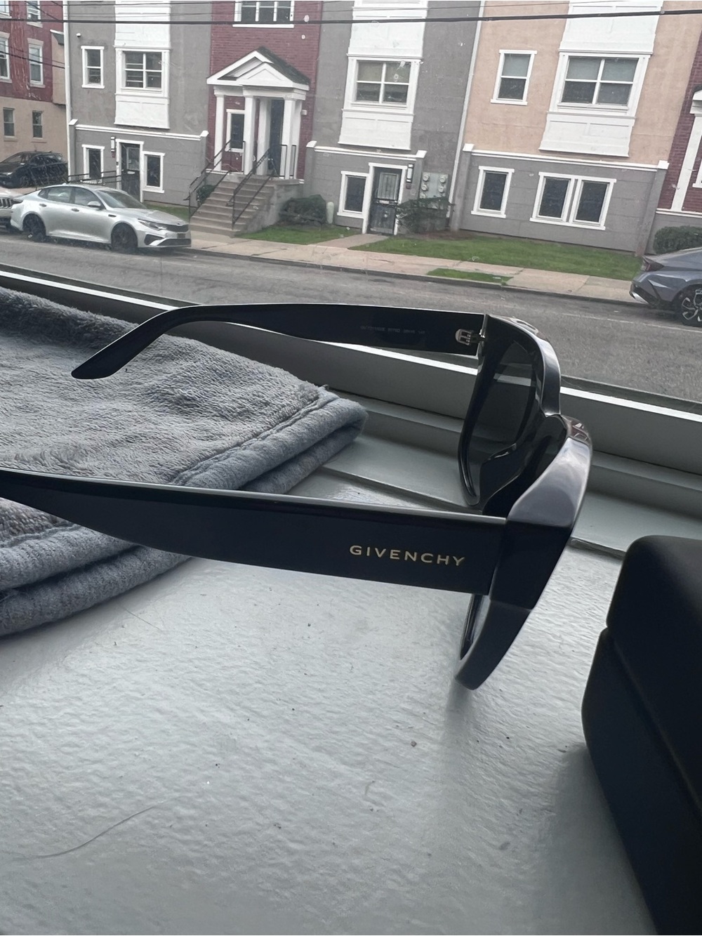 Givenchy Black Sunglasses with Gold Logo Accent